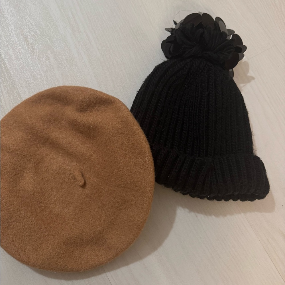 Two hats. Beret and knit black hat. Wool